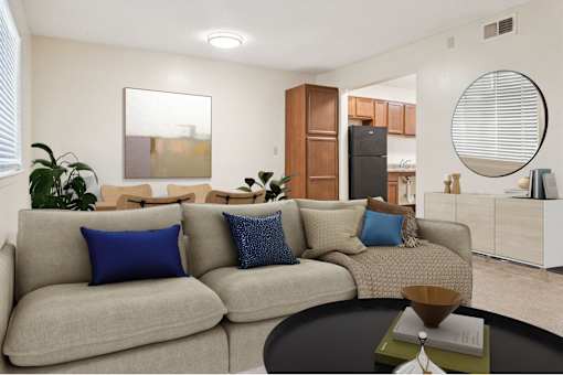 A living room with a grey couch and a coffee table.