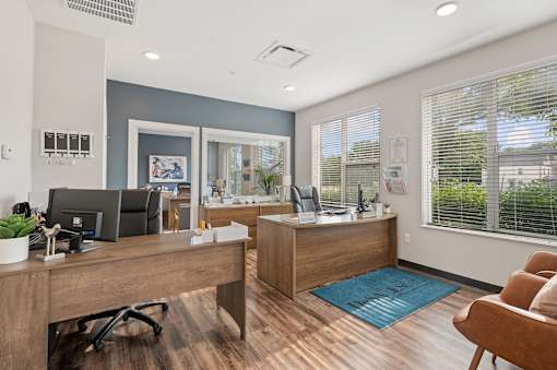 an office with two desks and a chair at DeSales Flats Apartments*, Cincinnati