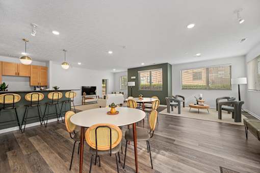 the reserve at bucklin hill clubhouse resident lounge with tables and chairs at DeSales Flats Apartments*, Cincinnati, Ohio