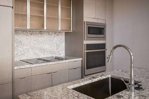 A modern kitchen with a sink and a microwave.at Sky Central, Cincinnati, OH 45202