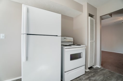 Kitchen With White Cabinetry And Appliances at Finneytown Apartments and Townhomes, Cincinnati, Ohio