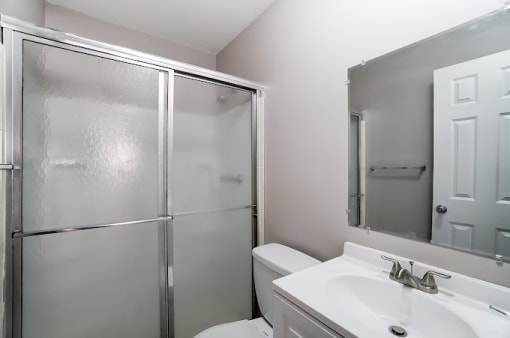 Walk-In Showers With Built-In Bench And Glass Enclosure at Finneytown Apartments and Townhomes, Cincinnati, OH, 45231