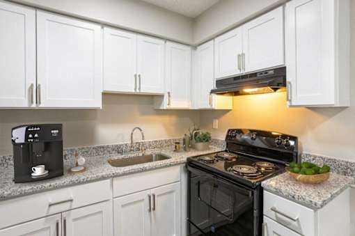 Kitchen with white cabinetry at Rivers at Bluegrass, Kentucky, 40503