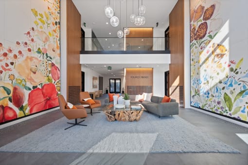 a living room with a couch and chairs in front of a wall of flowers at Four23/Hoge, Ohio, 45226