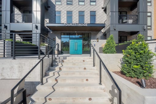 the entrance to a building with stairs and a blue door at Four23/Hoge, Ohio