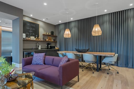 a living room and dining room with purple couch and chairs and a table and chairs at Four23/Hoge, Cincinnati, OH, 45226