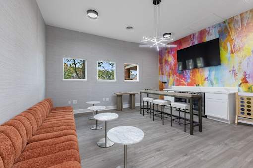 a living room with a couch and a table with chairs at Indian Lookout Apartments, Ohio, 45449