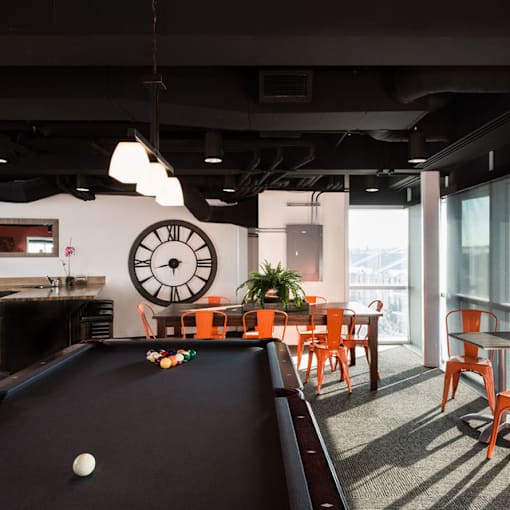 A pool table with a ball and a cue ball on it.