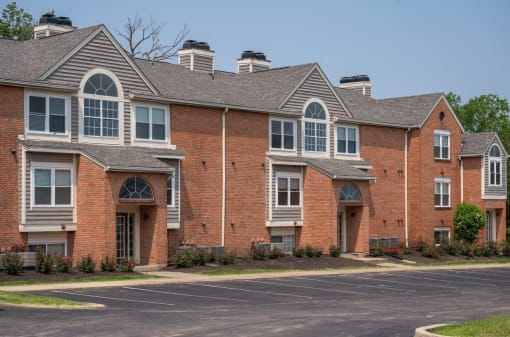 Large brick apartment building with a parking lot in front of itat  at Indian Lookout Apartments, Ohio, 45449