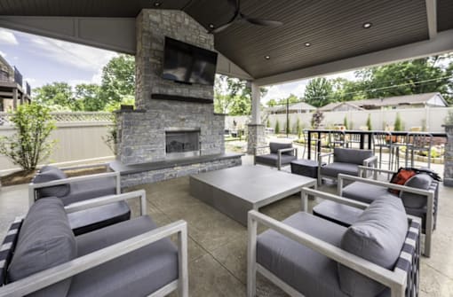 a patio with couches and a fireplace at Olde Towne in Kenwood, Ohio, 45243