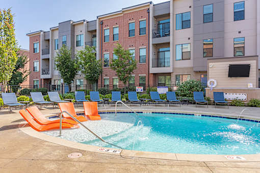 our apartments have a resort style pool with chairs at DeSales Flats Apartments*, Ohio, 45206