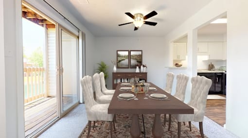 a dining room with a wooden table and chairs and a ceiling fan at Lawrence Landing, Indianapolis, IN 46226
