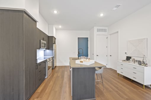 Kitchen with white walls and a wooden floor at Four23/Hoge, Cincinnati, 45226 at Four23/Hoge, Ohio