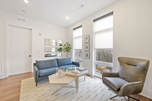 Living room with white walls and hardwood floors at Four23/Hoge, Ohio