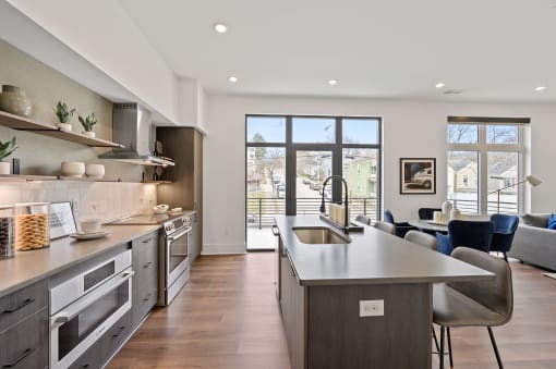 Kitchen with a large island and a view of the living room at Four23/Hoge, Cincinnati, OH, 45226
