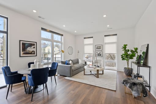 Living and dining room area with white walls and hardwood floors at Four23/Hoge, Cincinnati, OH