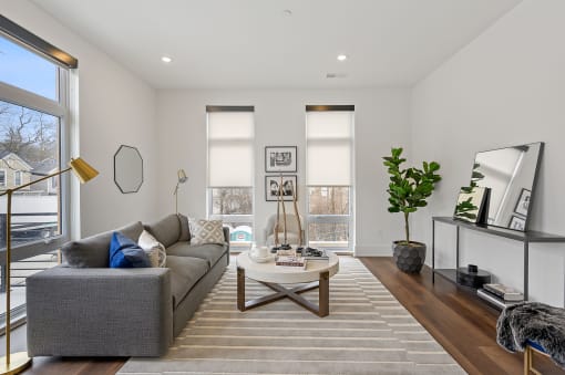 Living room with white walls and hardwood floors at Four23/Hoge, Ohio