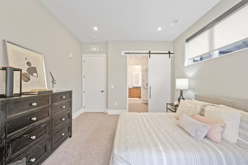 Bedroom with a large bed and a dresser at Four23/Hoge, Cincinnati, Ohio