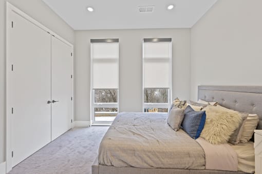 Bedroom with a large bed and three windows at Four23/Hoge, Cincinnati, 45226