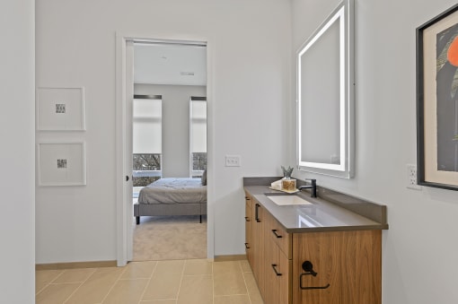 Bathroom with a sink and mirror in a 555 waverly unit at Four23/Hoge, Cincinnati
