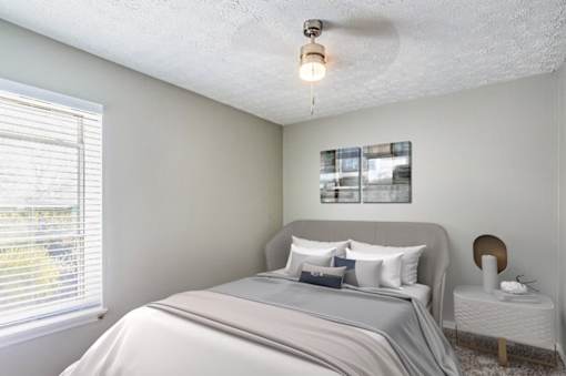 Bedroom with ceiling fan at Rivers at Bluegrass, Lexington