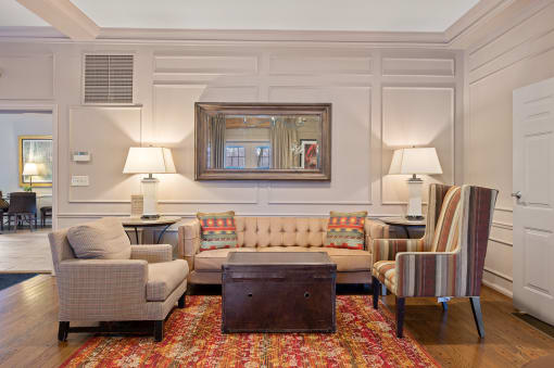a living room with couches chairs and a table at Indian Creek Apartments*, Ohio