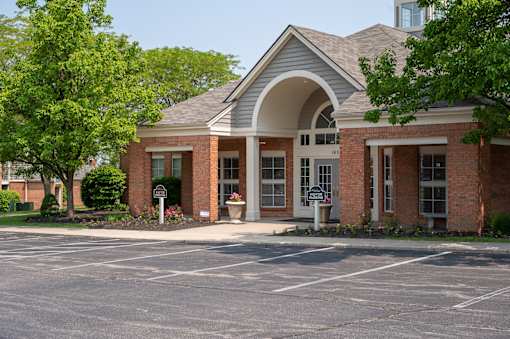 Building with a driveway and a parking lot at Indian Lookout, West Carrollton