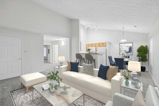 A living room with a white couch, a coffee table, and a rug.