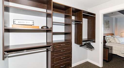 A room with a shelf, a drawer, and a sign that says "Good Day".