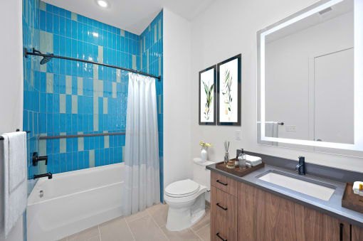 a bathroom with a shower toilet and a sink at Four23/Hoge, Cincinnati, Ohio