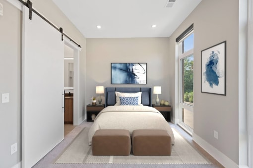 a white bedroom with a bed and a window at Four23/Hoge, Cincinnati
