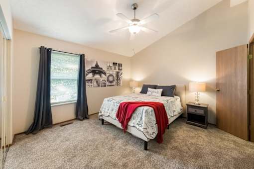 a bedroom with a bed and a ceiling fan at Parkside at Maple Canyon Apartments, Columbus, OH 43229