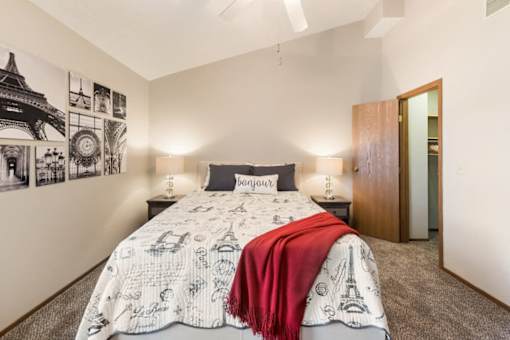 a bedroom with a bed and a closet at Parkside at Maple Canyon Apartments, Ohio