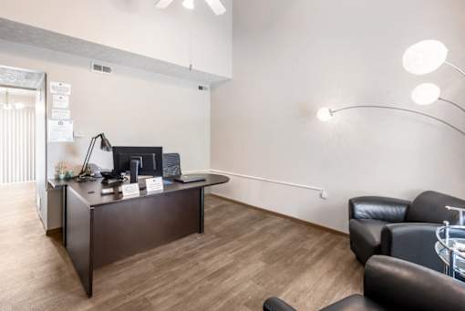 a living room with a desk and a couch at Parkside at Maple Canyon Apartments, Columbus, OH 43229