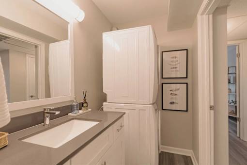 A bathroom with a sink and a mirror at A62 Apartments, Indianapolis