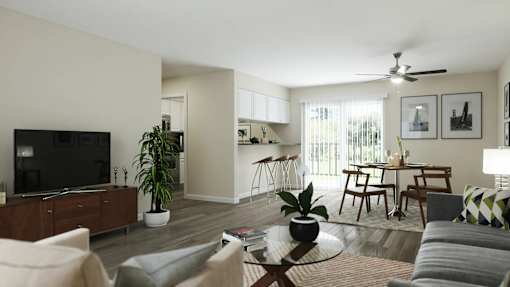 A living room with a television, a dining table, and a ceiling fan at A62 Apartments, Indiana