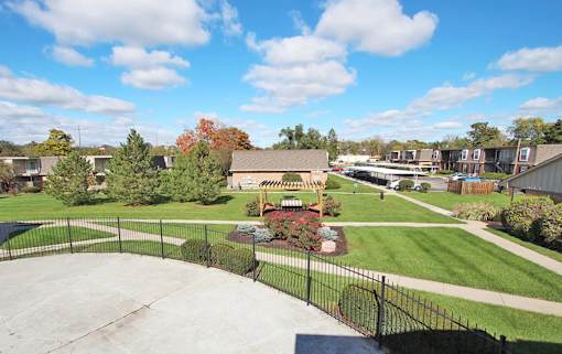 A skate park with a ramp and a fence at A62 Apartments, Indiana 46220