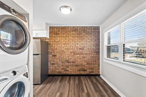 A laundry room with a washer and dryer.