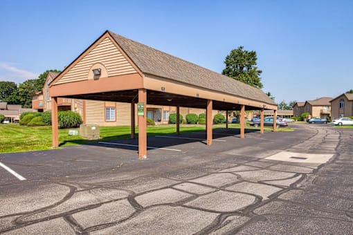 A parking lot with a building in the background.