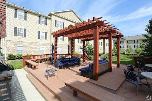 a backyard patio with a wooden deck and a pergola at Prescott Place, Ohio