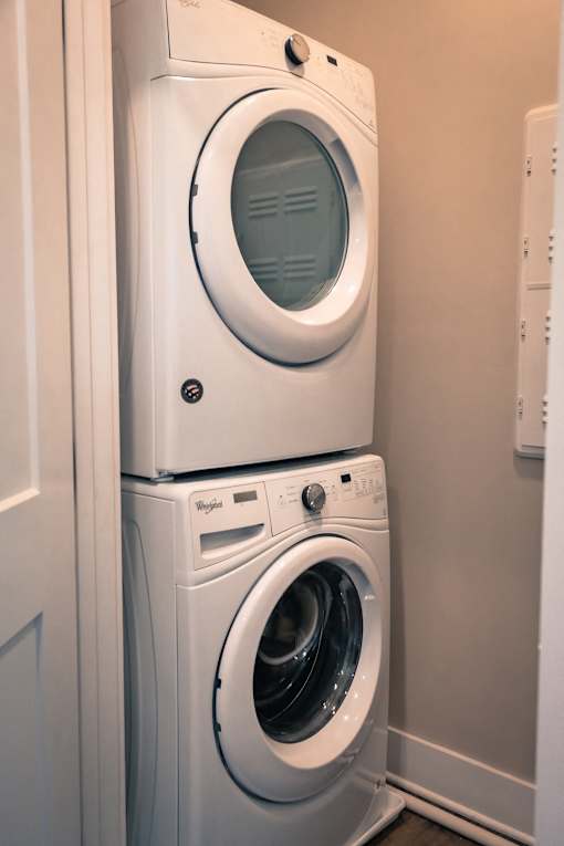 a small laundry room with a washer and dryer at DeSales Flats Apartments*, Ohio