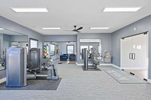a gym with cardio machines and other exercise equipment at Ten31, Ohio