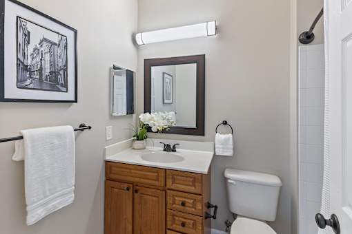 A bathroom with a towel hanging on a towel rack.