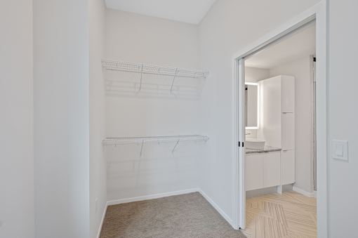 A white room with a drawing of a shelf on the wall at Sky Central Apartments, Cincinnati, OH
