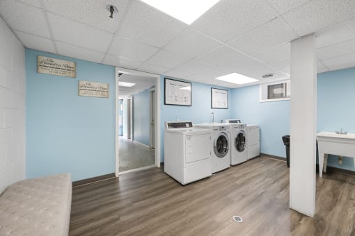 the preserve at ballantyne commons laundry room with washers and dryers