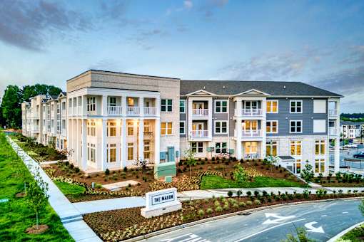 A row of townhouses with a sign that says