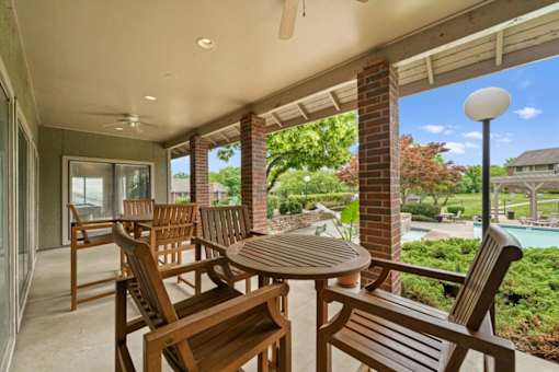 A patio with a table and chairs is shown.