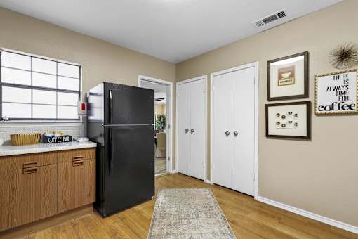 Kitchen with black refrigerator