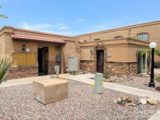 A house with a brown door and a brown wall.