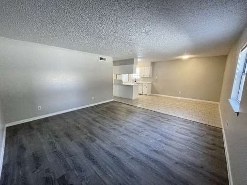 A room with a grey floor and white walls.